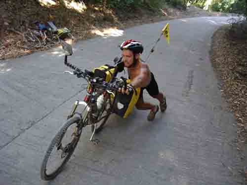 Dan, pushing bike up steep Bloomfield track